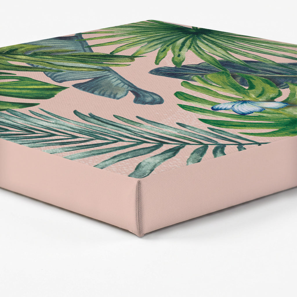 Edge of a canvas print with green leaf pattern on a pink background