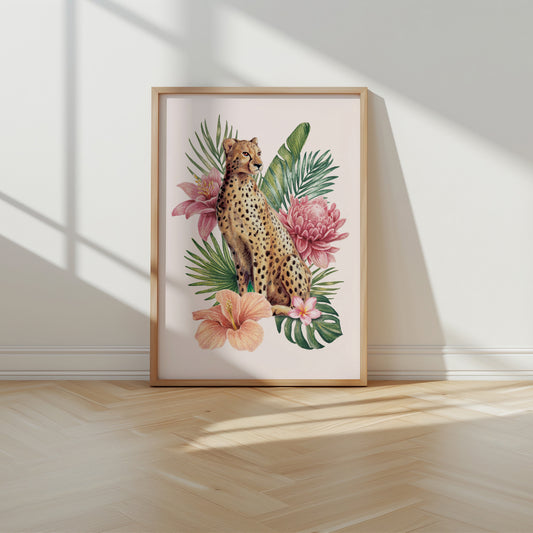 Framed artwork of a cheetah among tropical flowers on a wall.