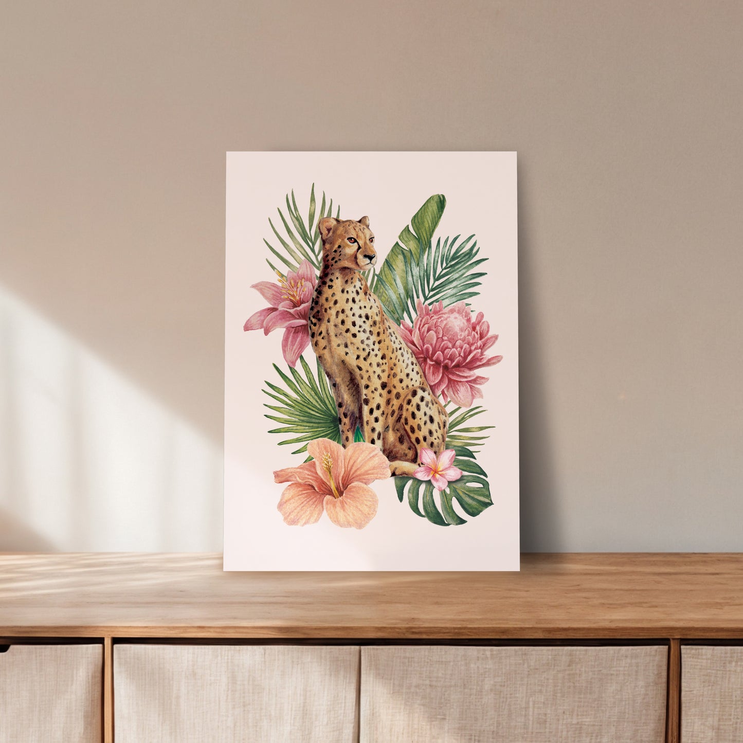 Print with a cheetah and tropical flowers on a wooden unit.