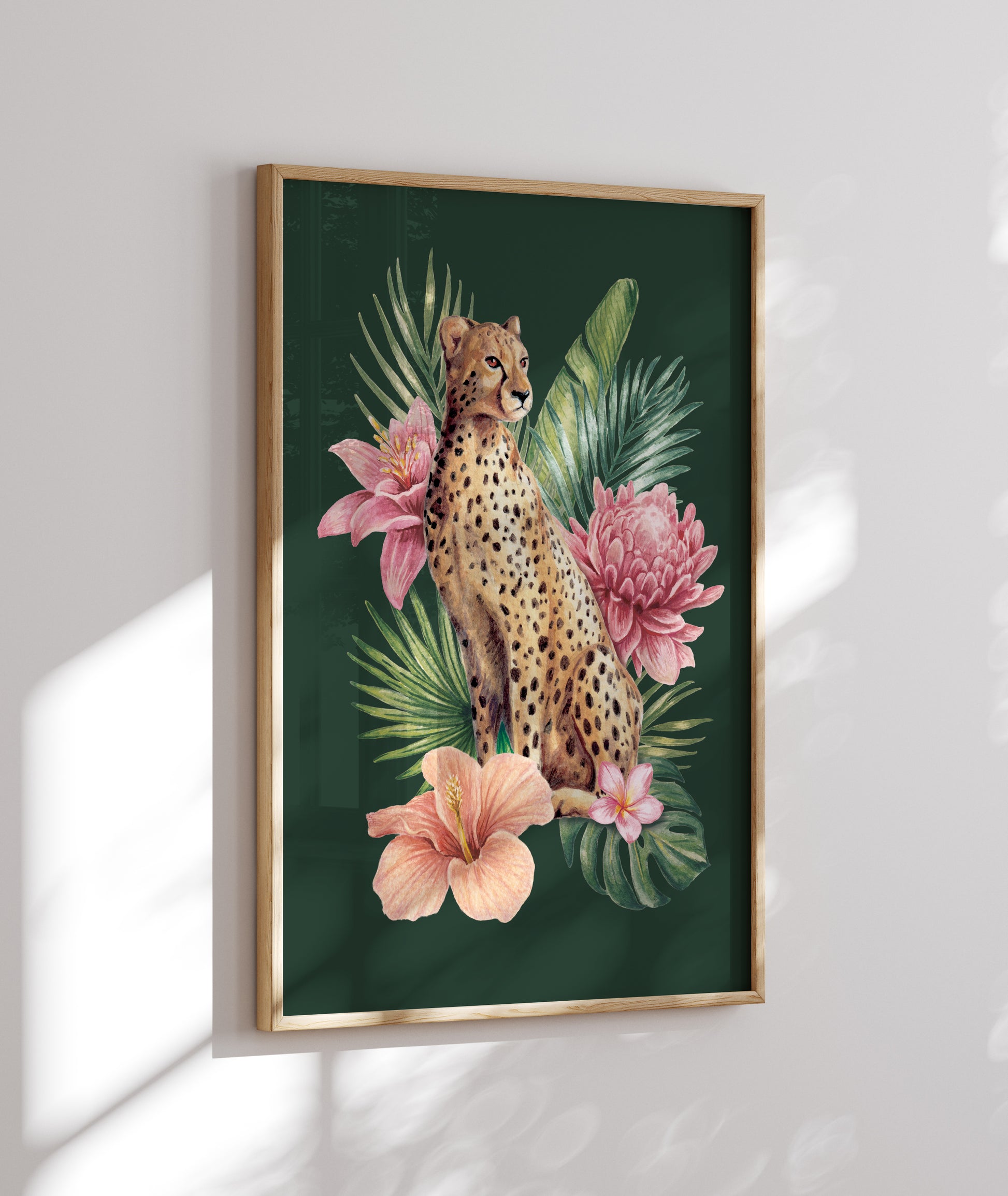 Framed artwork of a cheetah among tropical flowers on a green background