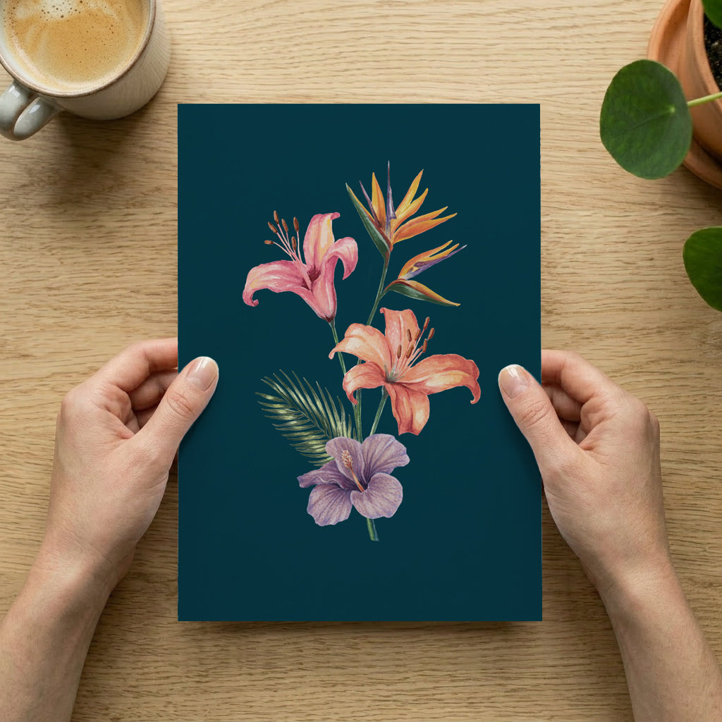 Floral artwork held by hands on a wooden table with a cup of coffee and plant.