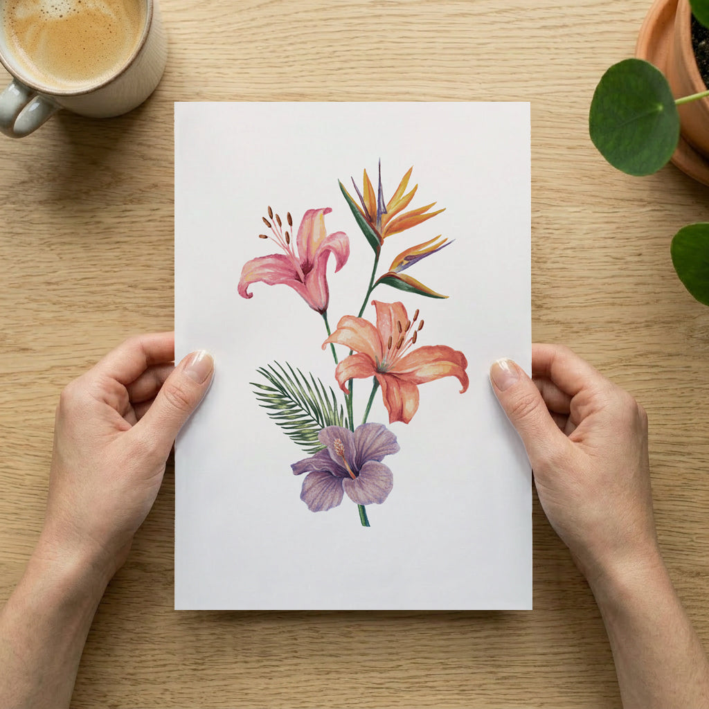 Floral illustration held by hands on a wooden table with a cup of coffee and plant.