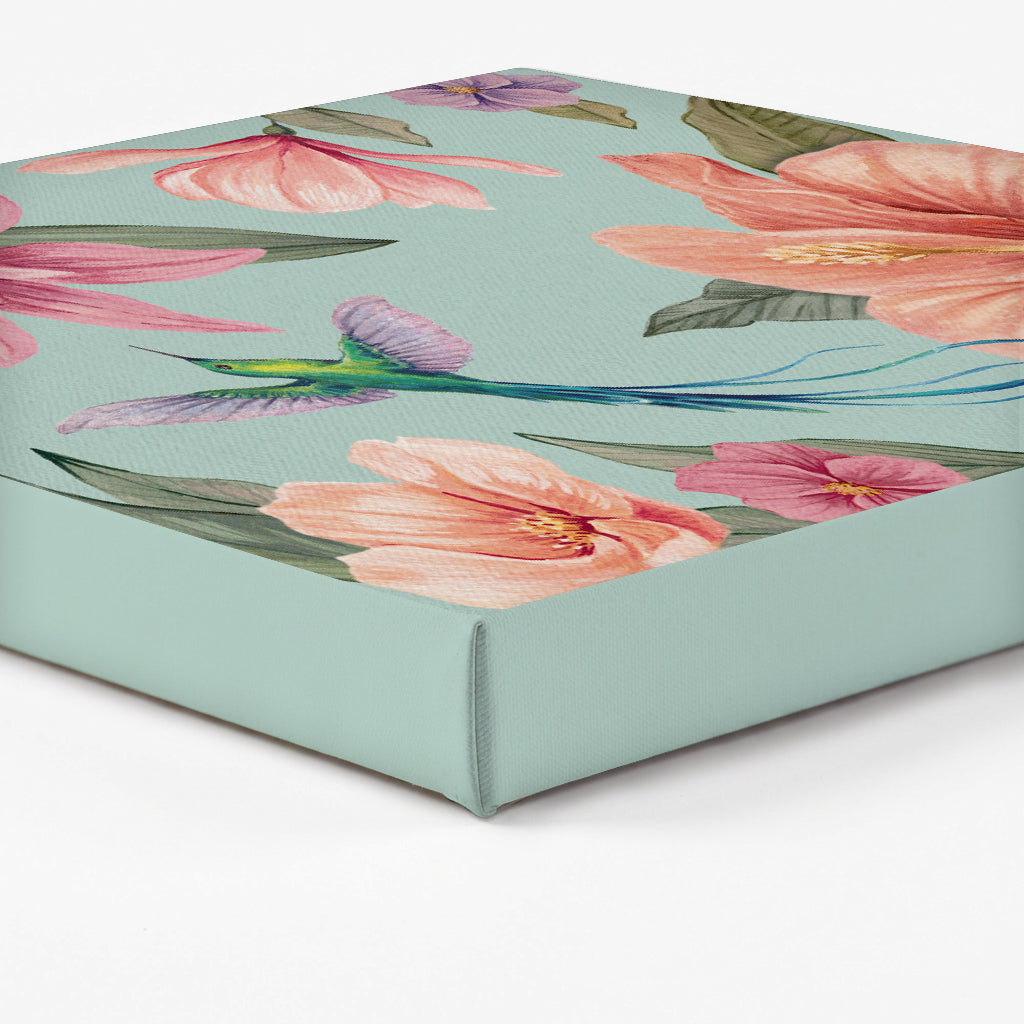 Edge of a canvas print with a tropical hummingbird artwork on an aqua blue background