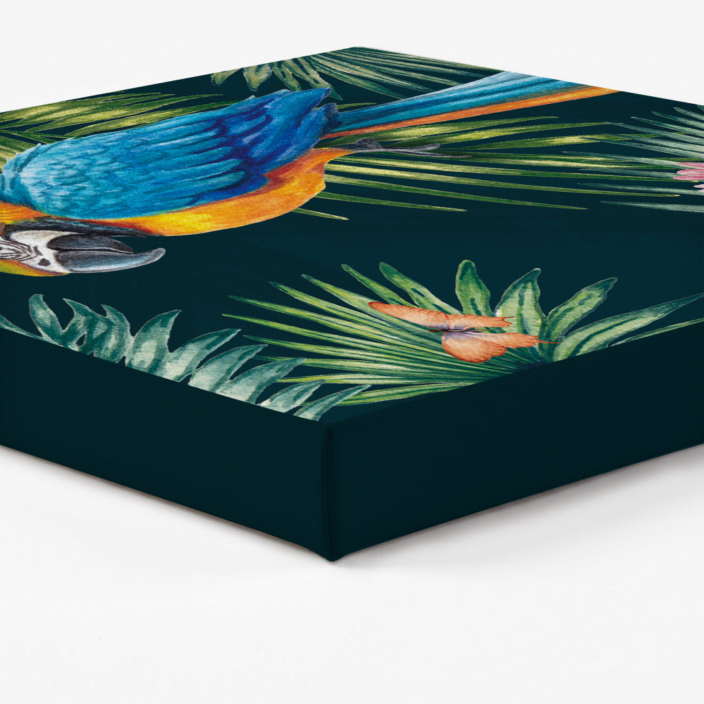 Edge of a canvas print with parrot and leaf design on a dark green background