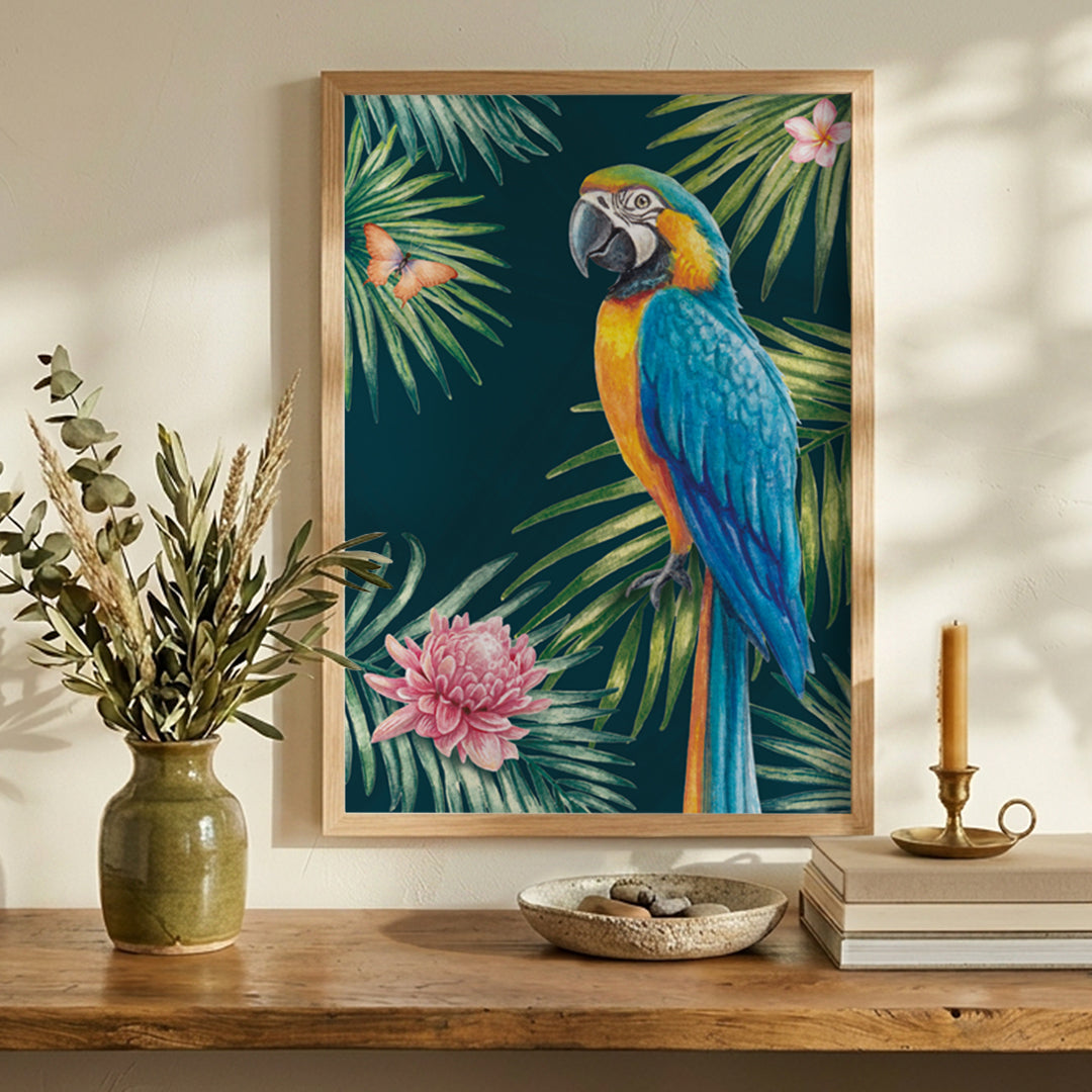 Framed artwork of a parrot and tropical leaves on a wall above a wooden shelf with decorative items.